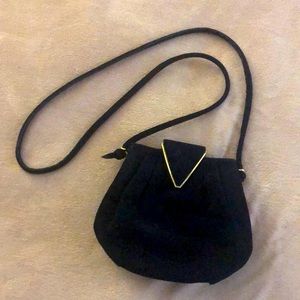 Black suede evening clutch by Cole Haan with gold accent